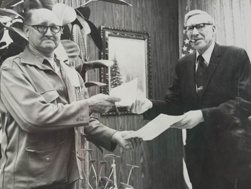 Arnold Muldoon, left, with Greater Anchorage Area Borough Mayor John Asplund, after the last of his homestead was sold to the Borough for less than half its appraised value; it is now Arnold L. Muldoon Park.